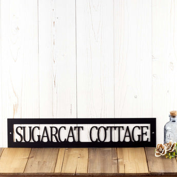 Hanging rectangular personalized cottage name metal sign, in matte black powder coat.