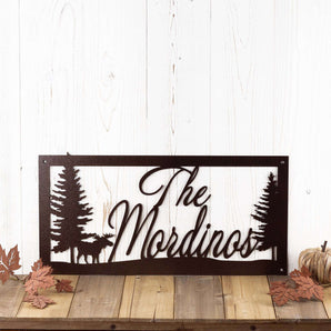 Rectangular family last name metal sign with moose silhouette, in copper vein powder coat.