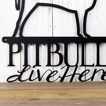 Close up of Pitbulls text on our Pitbull metal wall art, in matte black powder coat. 