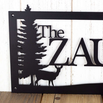 Close up of doe deer silhouette on our family name sign, in matte black powder coat.