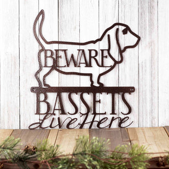 Basset hounds live here metal plaque with beware, in copper vein powder coat.