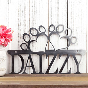 Custom dog name metal sign with paw prints, in raw steel.