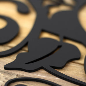 Close up of matte black powder coat on our welcome metal sign.