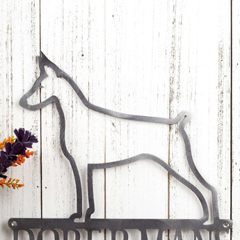 Close up of Doberman silhouette, on our Doberman metal sign, in raw steel.