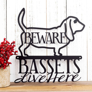 Basset hounds live here metal sign with beware, in matte black powder coat.