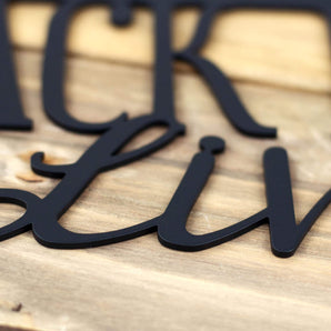 Close up of matte black powder coat on our Jack Russell metal sign.