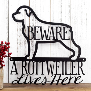 A Rottweiler Lives Here metal sign, with Beware, in matte black powder coat.