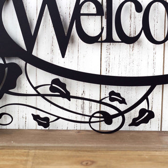 Close up of vines on our oval welcome metal sign, in matte black powder coat. 