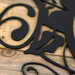 Close up of matte black powder coat on our 1 digit metal house number sign with vines and fleur de lis.