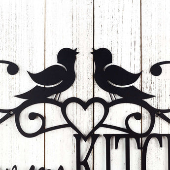 Close up of song birds and heart on our custom kitchen wall art, in matte black powder coat.