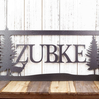 Rectangular metal family name sign, with a doe deer silhouette, in silver vein powder coat. 