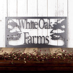 Rectangular metal family farm name sign with oak trees, in silver vein powder coat. 