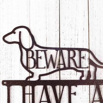 Close up of Dachshund dog silhouette on our I have a Two Foot Long Weiner metal wall art, in copper vein powder coat.