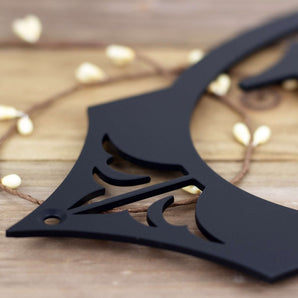 Close up of matte black powder coat on our metal house number sign.