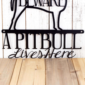 Close up of Pitbull text on our Pitbull metal wall art, in matte black powder coat.