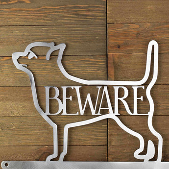 Close up of Chihuahua dog breed silhouette, with beware, in raw steel.