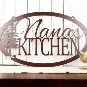 Oval custom kitchen name metal sign with pine trees, in copper vein powder coat.