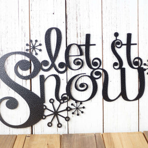 Close up of Let it Snow wording on our meta l wall art with snowflakes, in silver vein powder coat.