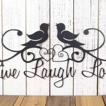Close up of hearts and birds on our Live Laugh Love metal sign, in silver vein powder coat.