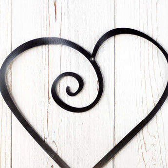 Curly heart metal wall art, in raw steel.