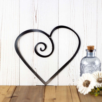 Curly heart metal wall decor, in raw steel.