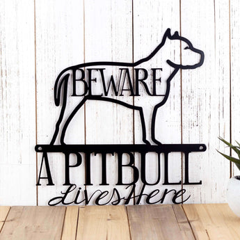 A Pitbull lives here metal sign, with beware, in matte black powder coat.