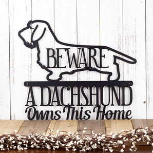 A Dachshund Owns This Home metal wall art, with Beware and Wire Haired Dachshund, in matte black powder coat. 