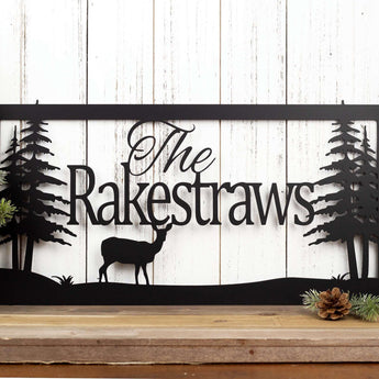 Rectangular metal plaque with doe deer silhouette and family name, in matte black powder coat. 