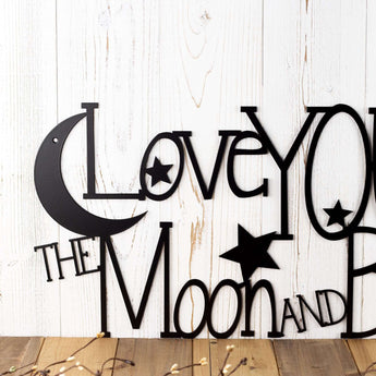 Close up of moon and stars on our Love You to the Moon and Back metal wall art, in matte black powder coat.