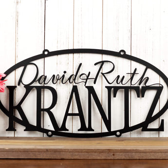 Hanging oval personalized metal sign with first and last names, in matte black powder coat. 