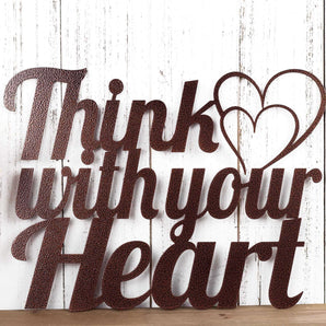 Close up of Think with your Heart metal sign, with two hearts, in copper vein powder coat.