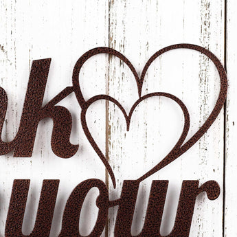 Close up of hearts on our Think with your Heart metal sign, in copper vein powder coat.