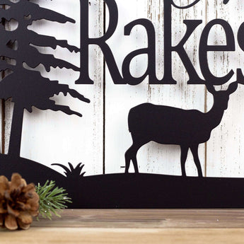 Close up of doe deer silhouette on our rectangular family name sign, in matte black powder coat.