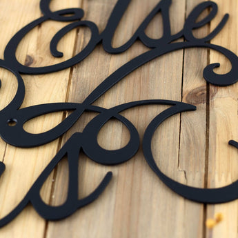 Close up of matte black powder coat on our Nothing Else Matters metal wall decor. 