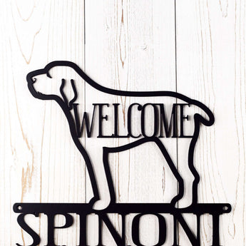 Close up of Spinoni dog silhouette and welcome word, on our Spinoni Live Here metal sign, in matte black.