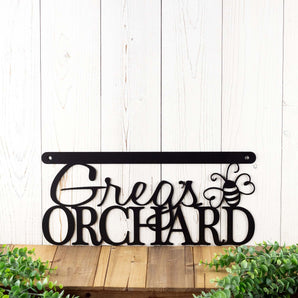 Hanging orchard metal sign with first name and dragonfly, in matte black powder coat.