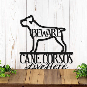 Cane Corsos live here metal wall art with a Cane Corso dog silhouette, in matte black powder coat.