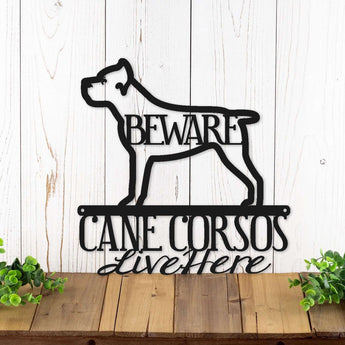 Cane Corsos live here metal wall art with a Cane Corso dog silhouette, in matte black powder coat.