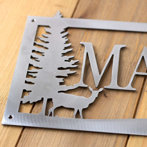 Close up of raw steel on our custom family name metal sign with doe deer silhouette. 