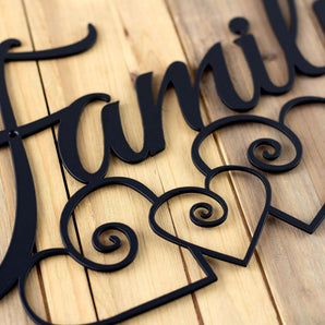 Close up of matte black powder coat on our family metal sign.