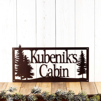 Rectangular personalized home name metal plaque with pine trees, in copper vein powder coat.