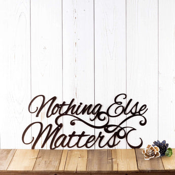 Nothing Else Matters metal wall art with scrolls, in copper vein powder coat.