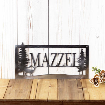 Rectangular metal family name sign, with a doe deer silhouette, in raw steel. 
