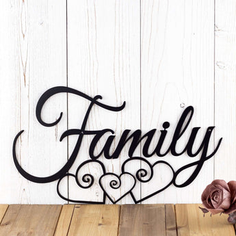 Close up of family script metal sign with three hearts, in matte black powder coat. 