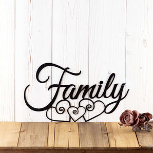 Family script metal sign with three hearts, in matte black powder coat.