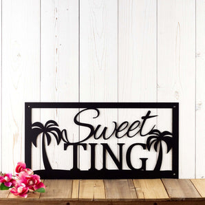 Rectangular family name metal sign with palm trees, in matte black powder coat.