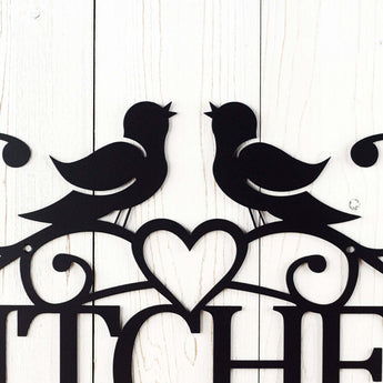 Close up of love birds and heart on our Kitchen metal sign, in matte black powder coat.