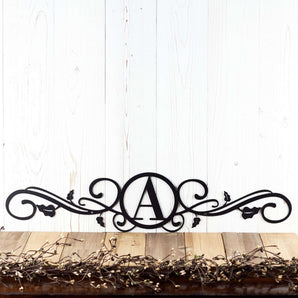 Metal monogram sign with vines, in matte black powder coat.