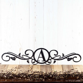 Metal monogram sign with vines, in matte black powder coat.