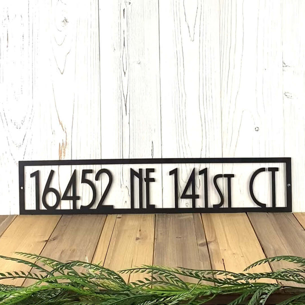 Video of rectangular art deco metal address sign, in matte black powder coat.
